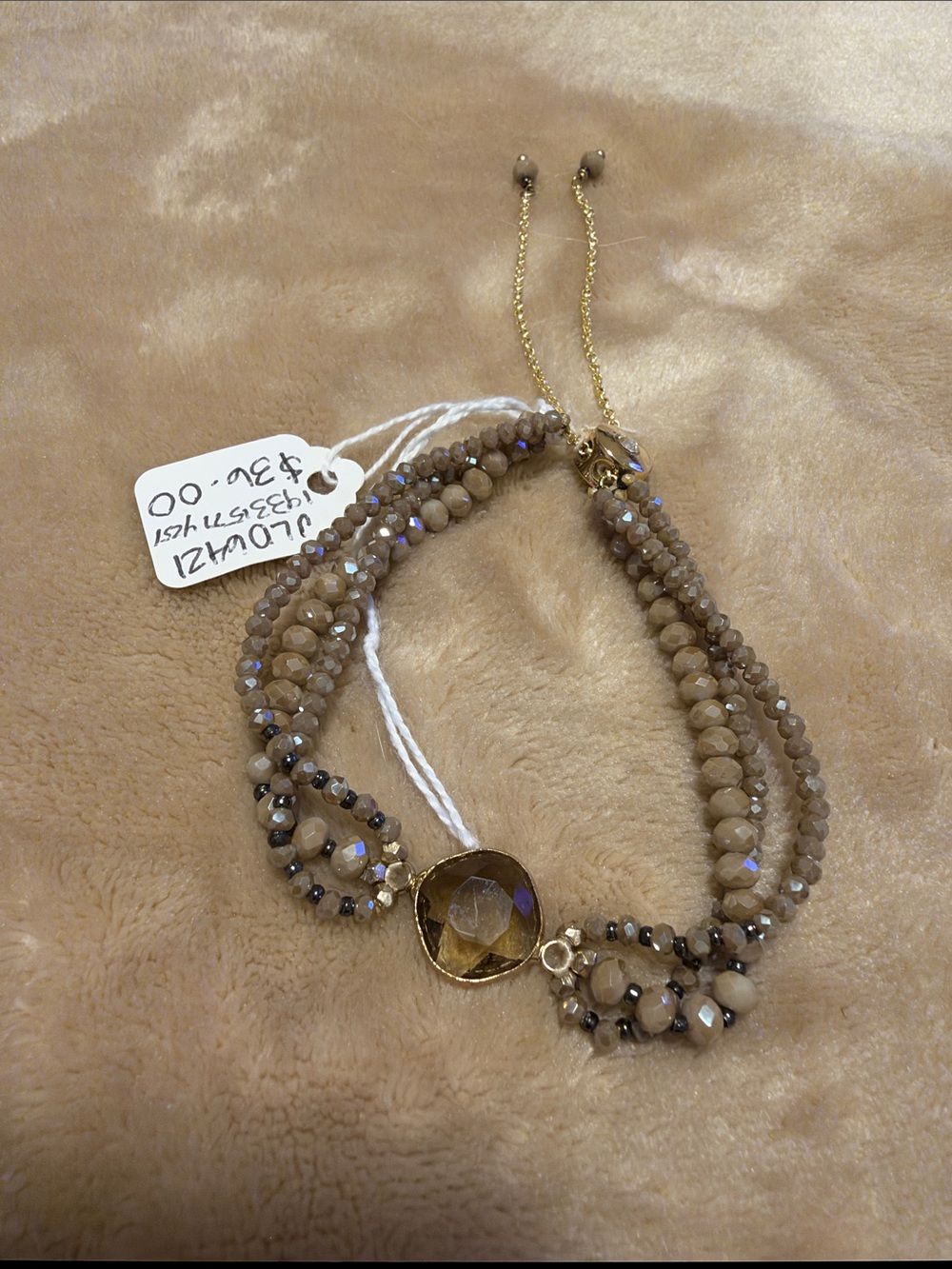 Multi-Strand Brown Beaded Bracelet with Faceted Center Stone
